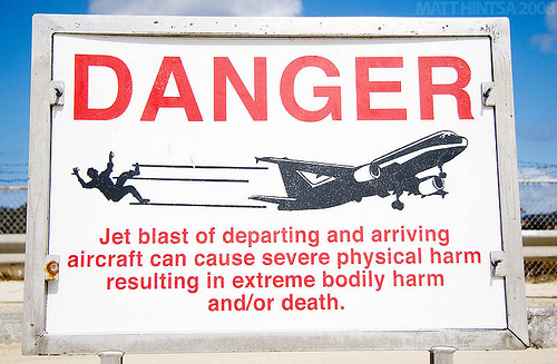 Maho Beach - Sign Warns Tourists About Departing and Arriving Aircraft