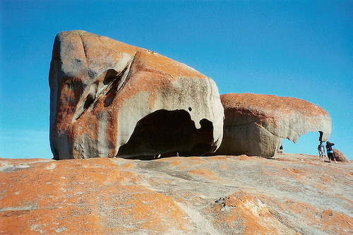 Remarkable Rocks Hollow Formations Covered in Orange Lichen, Photo: thornj, Flickr