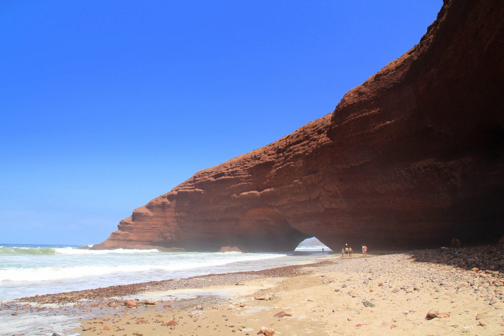 View of Natural Arches on Legzira Beach from  Distance, Photo by Just Booked A Trip, Flickr