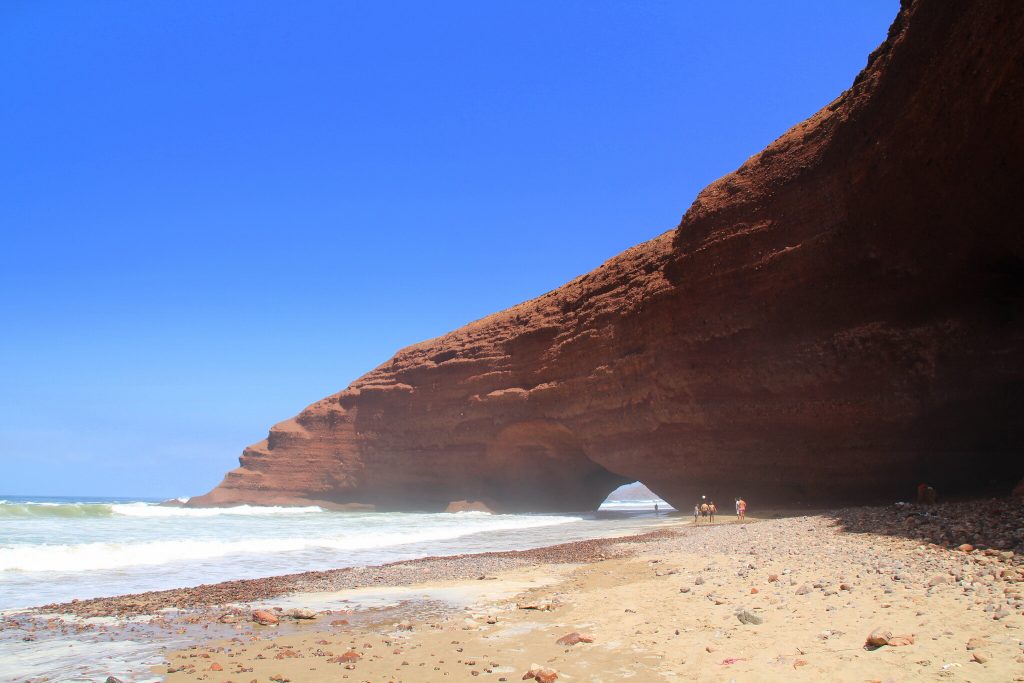 View of Natural Arches on Legzira Beach from Distance, Photo by Just Booked A Trip, Flickr